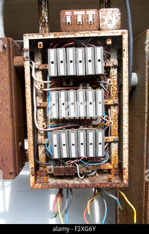 Old rusty electrical fuse box, UK Stock Photo