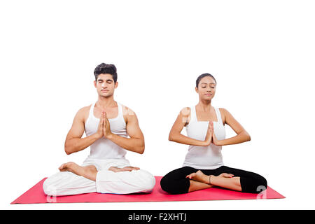 2 indian couple Yoga Surya Namaskar Stock Photo