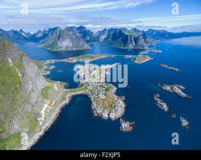 Reine surrounded by deep fjords and magnificient peaks on Lofoten islands in Norway Stock Photo