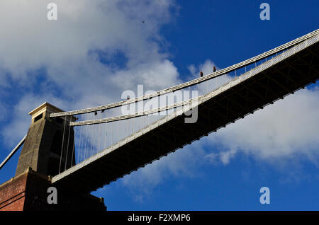 Bristol, UK. 25th September, 2015. Workmen seen Walking along the TOP of the Main Support of World Famous Clifton Suspension Bridge in Clifton while under going painting and checks. Credit:  Robert Timoney/Alamy Live News Stock Photo