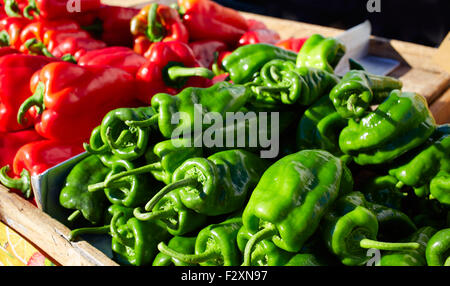 Green and red peppers in the market outdoor Stock Photo