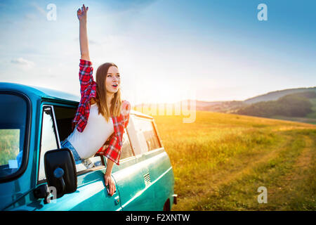 Teenage girl and her friends on a road trip on a summers day Stock Photo