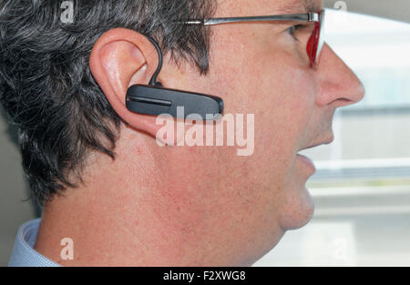 Wireless bluetooth hands free headset Stock Photo