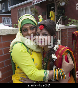 Bangladeshi Muslim mother and daughter dressed for her brother's wedding in Brooklyn, NY. Stock Photo