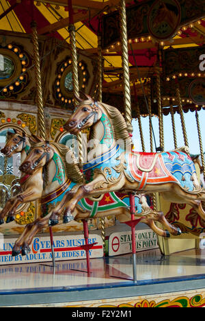 Carousel horses on a merry go round Stock Photo