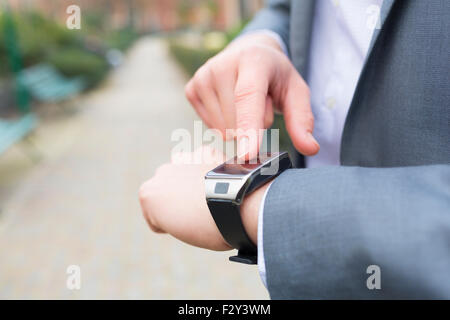 Man using a smartwatch. close-up hands Stock Photo