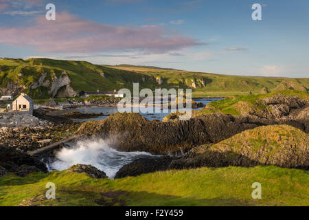 Early morning on the rocks overlooking Ballintoy, County Antrim, Northern Ireland, UK Stock Photo