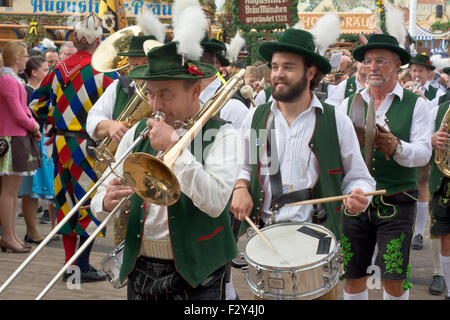 MUNICH, GERMANY – SEPT. 20, 2015: Traditional Marching Bands with Local Costumes entertain Crowds of visitors at the annual Oktoberfest. The Festival runs from September 19th until October 4th 2015 in Munich, Germany