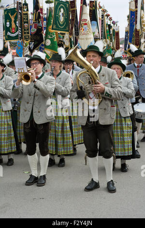MUNICH, GERMANY – SEPT. 20, 2015: Traditional Marching Bands with Local Costumes entertain Crowds of visitors at the annual Oktoberfest. The Festival runs from September 19th until October 4th 2015 in Munich, Germany.