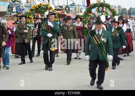 MUNICH, GERMANY – SEPT. 20, 2015: Traditional Marching Group with Local Costumes entertain Crowds of visitors at the annual Oktoberfest. The Festival runs from September 19th until October 4th 2015 in Munich, Germany.