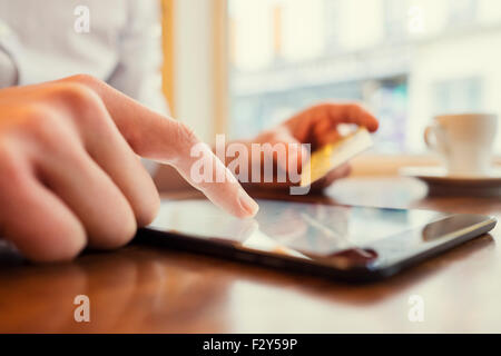 Man using Tablet pc. Credit card, Shopping online. Window background Stock Photo
