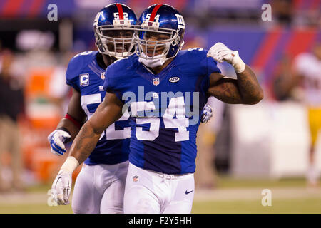 New York Giants linebacker Jonathan Goff (54) wraps and tackles Chicago  Bears running back Matt FortÅ½ (22) during second half NFL action in the New  York Giants' 17-3 victory over the Chicago