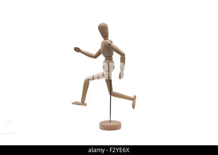 drawing doll isolated running. wooden doll runs on white background Stock Photo