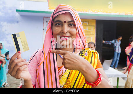 1 indian rural Villager woman Worker Credit Card showing finger pointing Stock Photo
