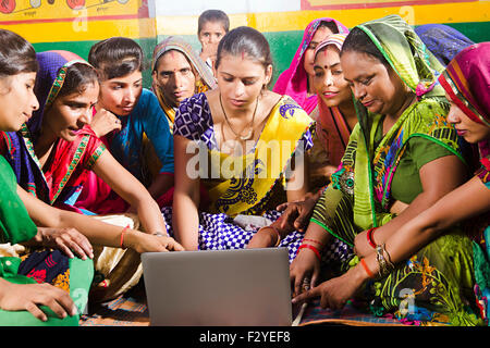 indian rural Villager group crowds womans Laptop Education Stock Photo