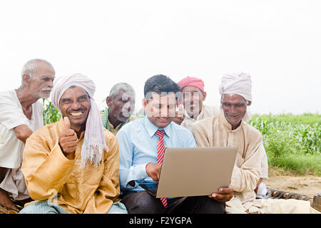 indian Business Man and rural farmer group crowds farm laptop working Stock Photo