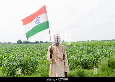 1 indian rural Senior farmer farm standing Flag Independence Day Stock Photo