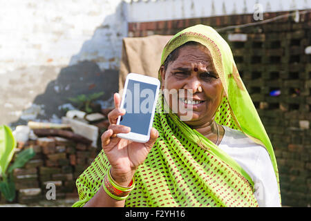 1 indian rural Senior woman Mobile Phone Quality showing Stock Photo