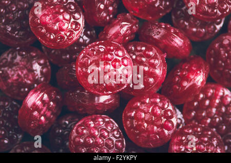 Pile of tasty delicious raspberry hard candy shaping a snowflake type ...