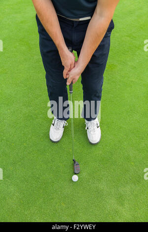 Golf player with club Stock Photo