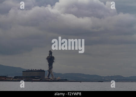 Cockenzie, Scotland, UK. 26th Sep, 2015. Demolition of the two 149m high chimneys of the coal-fired power station at Cockenzie, on the shores of the Firth of Forth near Edinburgh, Scotland, UK. The power station was opened in 1967 and was decomissioned in March 2013. The chimney stacks were brought down by controlled explosion at noon on 26th September 2015. Credit:  FeedStock/Alamy Live News Stock Photo