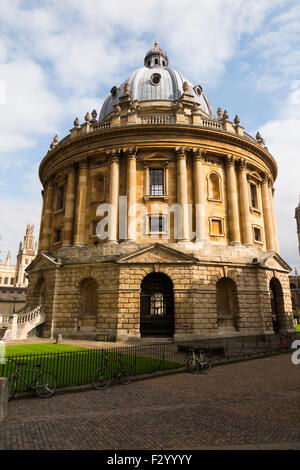 Radcliffe Camera building, with sun on a sunny day with blue sky / skies; part of Oxford University. Oxford. UK. Stock Photo