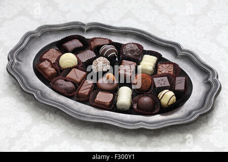 assorted chocolate on pewter dish Stock Photo