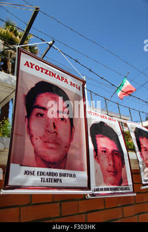 La Paz, Bolivia, 26th September 2015. Photos of the 43 missing students in Mexico hanging on a barbed wire security fence outside the Mexican Embassy in La Paz, today is the first anniversary of their disappearance. The students (who were from a teacher training college in Ayotzinapa) disappeared on the night of 26th September 2014 in the town of Iguala in Guerrero State. The Mexican government's handling of the case has been widely criticised and a team sent by the Inter-American Commission on Human Rights found a number of flaws in the government's investigation. Stock Photo