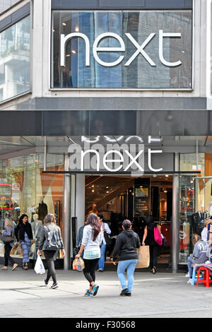 Next store shop entrance for retail clothing shopping shop front on Oxford Street West End London England UK with shoppers on pavement Stock Photo