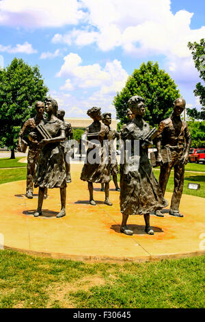 Statues of the Little Rock Nine stand just below the governor's office window at the Arkansas State Capital Building Stock Photo