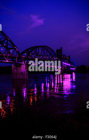 The 1899 Rock Island Railroad Bridge across the Arkansas River at night from North Little Rock Stock Photo