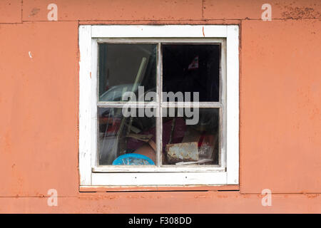 Rustic vintage window on red wall Stock Photo