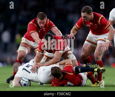 London, UK. 26th Sep, 2015. Mike Brown (1st L) of England is tackled by players of Wales during the Rugby World Cup 2015 Pool A match between England and Wales at the Twickenham Stadium in London, Britain on September 26, 2015. England lost 25-28. Credit:  Han Yan/Xinhua/Alamy Live News Stock Photo