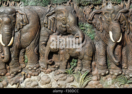Beautiful elephants carve on wood Stock Photo