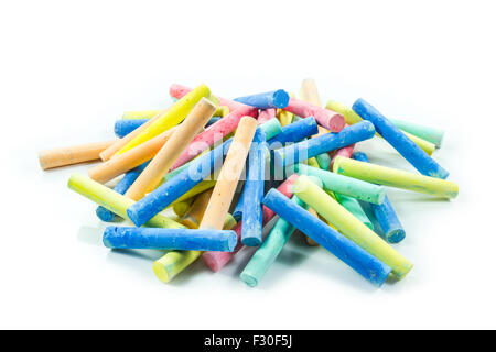 coloured chalks on a white background Stock Photo