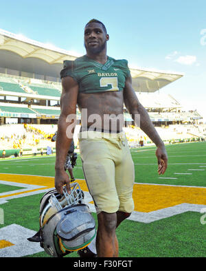 Baylor defensive end Shawn Oakman, left, rushes against Oklahoma State