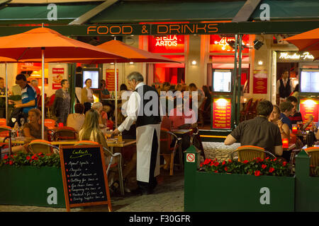 A Pavement restaurant in the market square in Brugge, Belgium Stock Photo