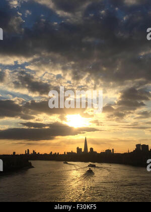 London, UK.  26th September 2015. Historical paddle steamer The Waverely heading past Rotherhithe and Limehouse downstream, passing a modern tourist cruise boat along The River Thames. The Waverely is the last sea-going paddle steamer in the world. Credit:  Glenn Sontag / Alamy Live News Stock Photo