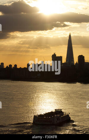 London, UK.  26th September 2015. Historical paddle steamer The Waverely heading past Rotherhithe and Limehouse downstream, passing a modern tourist cruise boat along The River Thames. The Waverely is the last sea-going paddle steamer in the world. Credit:  Glenn Sontag / Alamy Live News Stock Photo