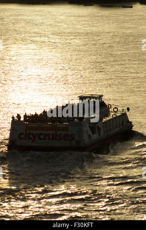 London, UK.  26th September 2015. Historical paddle steamer The Waverely heading past Rotherhithe and Limehouse downstream, passing a modern tourist cruise boat along The River Thames. The Waverely is the last sea-going paddle steamer in the world. Credit:  Glenn Sontag / Alamy Live News Stock Photo