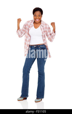 excited young African woman holding fists on white background Stock Photo