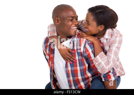 cheerful young black couple piggybacking on white background Stock Photo