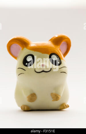 Japanese plastic Anime Hamtaro hamster cartoon character, Hamutaro, from the Ham-Ham gang. Anime figure against white background. Stock Photo