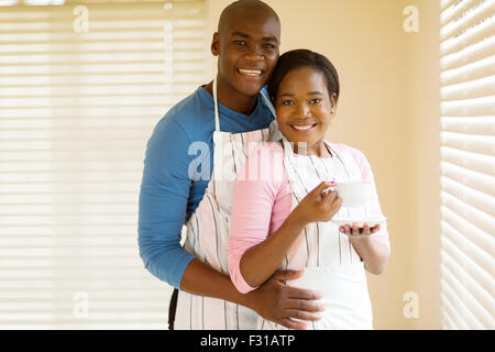 lovely young African couple relaxing after doing housework Stock Photo