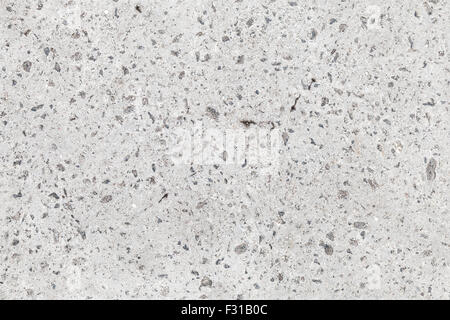 Seamless background texture of gray concrete wall with gravel