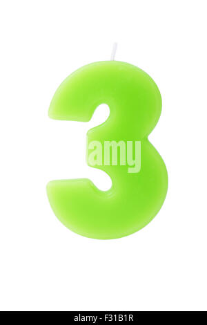 Green birthday candle in the form of the number three on white background Stock Photo