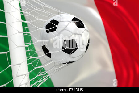 Italy flag and soccer ball, football in goal net Stock Photo