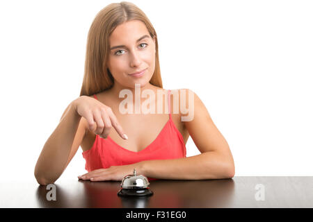 Woman about to ring a counter bell isolated in white Stock Photo