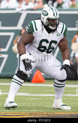 October 26, 2014: New York Jets quarterback Michael Vick (1) gets sacked by  Buffalo Bills defensive end Jarius Wynn (92), who got past New York Jets  guard Willie Colon (66) during the