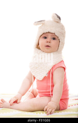 Cute baby girl wearing fluffy bunny hat isolated on white background Stock Photo